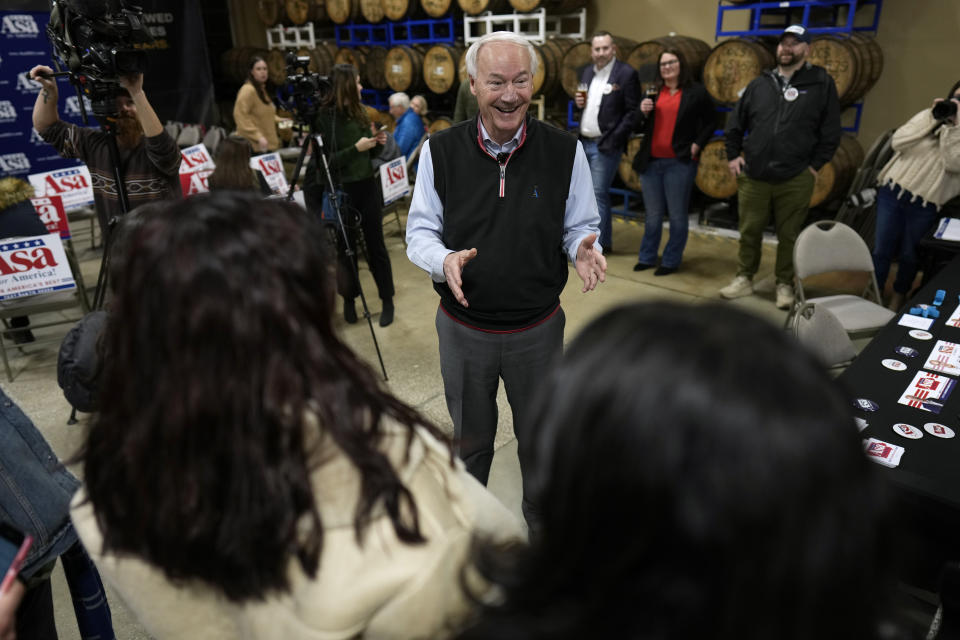 FILE - Republican presidential candidate former Arkansas Gov. Asa Hutchinson talks with students during a campaign event, Jan. 3, 2024, in Des Moines, Iowa. Hutchinson is dropping out of the race for the Republican presidential nomination after finishing sixth in Iowa's leadoff caucuses. The former Arkansas governor said Tuesday, Jan. 16, 2024, that his poor performance in Iowa showed him that he has no path to the Republican nomination. (AP Photo/Charlie Neibergall, File)