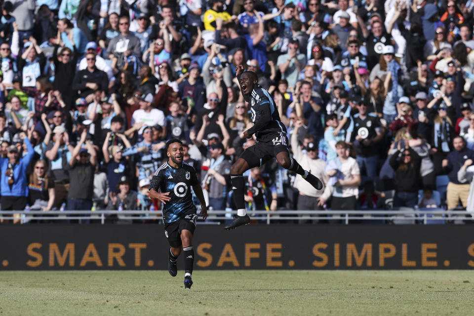 Minnesota United midfielder Tanitoluwa Oluwaseyi (14) reacts after scoring during the second half of an MLS soccer match against the Columbus Crew, Saturday, March 2, 2024, in St. Paul, Minn. (AP Photo/Stacy Bengs)