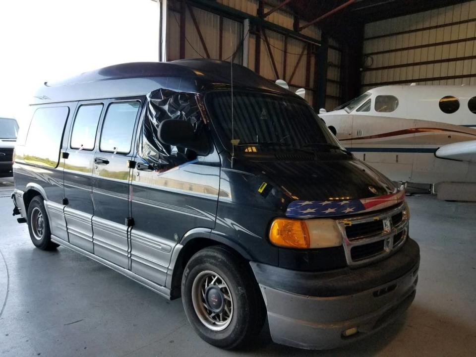 The black Dodge conversion van belonging to Steven Wolf, who was arrested on a murder charge in the death of a Florida woman on Nov. 21, 2018, sits inside the Monroe County Sheriff’s Office hangar in Marathon, Florida. Monroe County Sheriff's Office