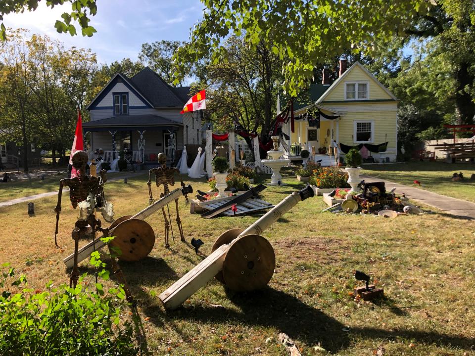 The houses at 1333 and 1337 N. Clay Ave. feature a variety of Halloween decorations in their front yards on Friday, Oct. 14, 2022.