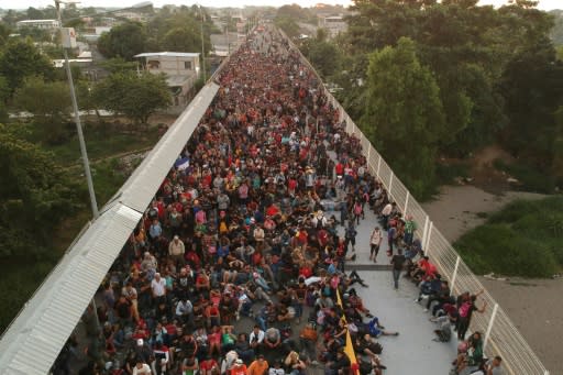 Central American migrants at the international bridge connecting Tecum Uman, Guatemala, with Ciudad Hidalgo, Mexico