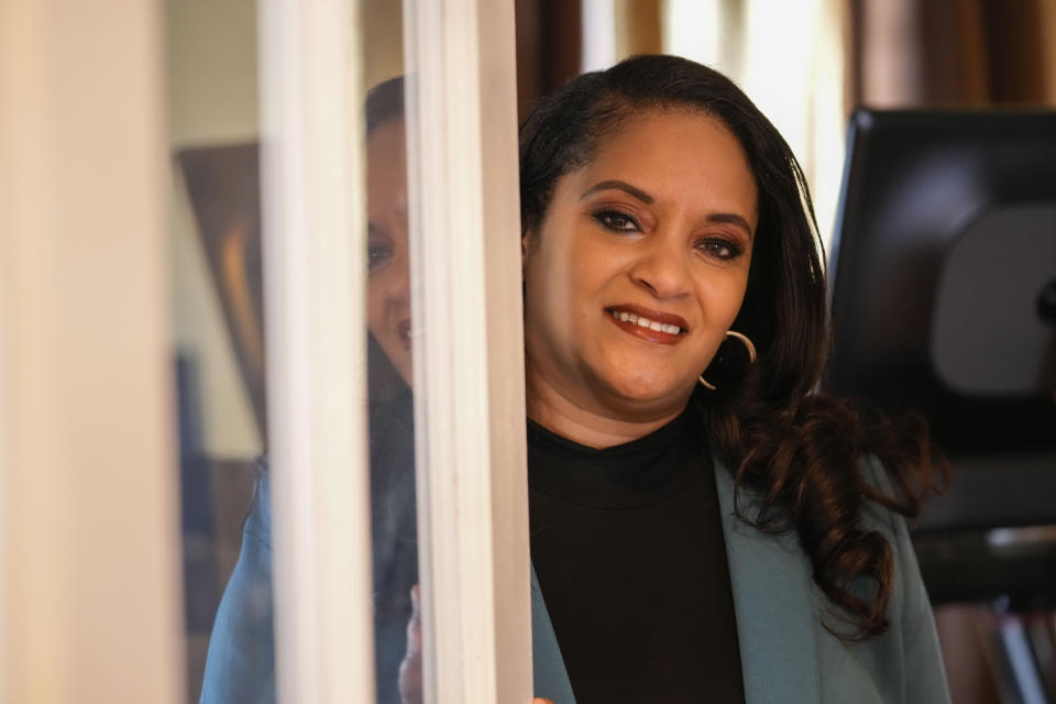 Ashley K. Shelton, executive director of Power Coalition for Equity & Justice in Louisiana, a voter advocacy organization that is trying to get left-leaning voters engaged for next year's elections, possess for a photo at her family home in Baton Rouge, La., Tuesday, Dec. 26, 2023. (AP Photo/Gerald Herbert)