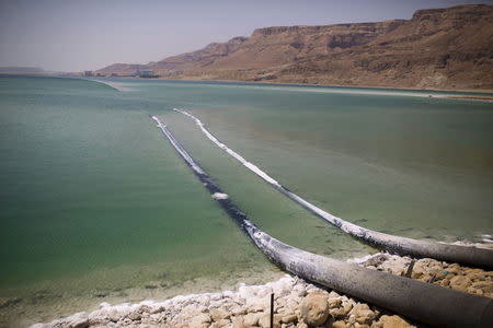 Pipes that pump water cross through evaporation pools, which today make up the southern part of the Dead Sea, Israel July 27, 2015. REUTERS/Amir Cohen