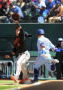 Baltimore Orioles third baseman Ryan Mountcastle (6) reaches for the ball as Texas Rangers second baseman Nick Solak (15) beats out the throw in the sixth inning during a baseball game on Sunday, April 18, 2021, in Dallas. (AP Photo/Richard W. Rodriguez)