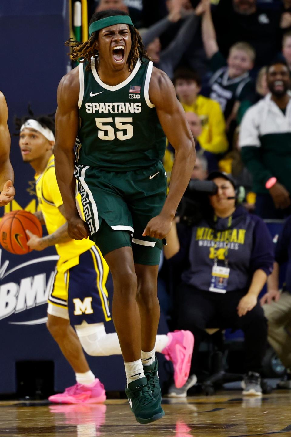 Michigan State Spartans forward Coen Carr celebrates after he dunks in the first half against the Michigan Wolverines at Crisler Center in Ann Arbor on Saturday, Feb. 17, 2024.