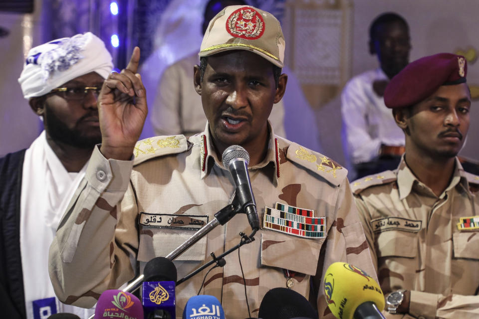 In this Saturday, May 18, 2019 photo, Gen. Mohammed Hamdan Dagalo, better known as Hemedti, the deputy head of the military council that assumed power in Sudan after the overthrow of President Omar al-Bashir, speaks to journalists in Khartoum, Sudan. At 44, he is the youngest member of the council. He says he refused orders from al-Bashir to fire on the protesters, and he praised them as recently as last weekend. (AP Photo)