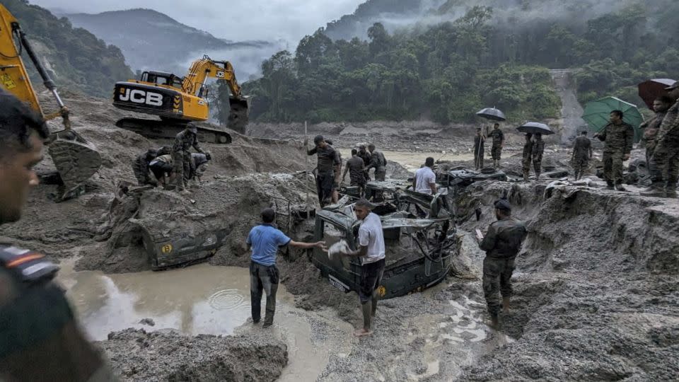 Members of Indian Army try to recover buried trucks in Sikkim on October 5, 2023.  - Indian Army/Handout/Reuters