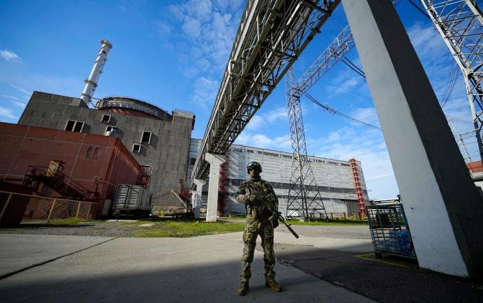 A Russian serviceman guards an area of the Zaporizhzhia nuclear power station