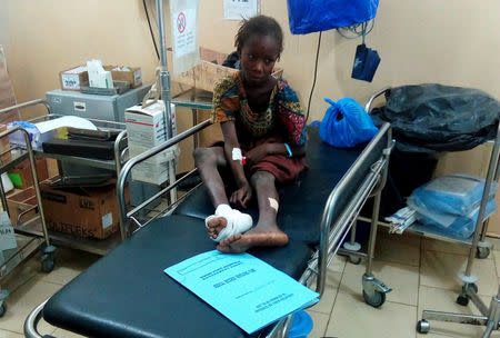 An injured girl sits inside a hospital after a suspected Boko Haram attack on the edge of Maiduguri's inner city, Nigeria April 2, 2018. REUTERS/Ahmed Kingimi