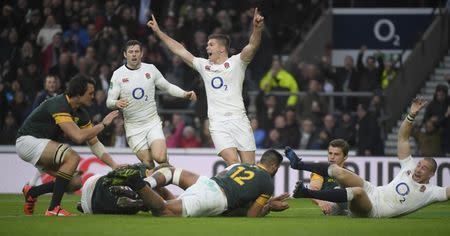 Britain Rugby Union - England v South Africa - 2016 Old Mutual Wealth Series - Twickenham Stadium, London, England - 12/11/16 England's Owen Farrell (C) and Mike Brown (R) celebrate after Courtney Lawes (hidden) scores their second try Reuters / Toby Melville