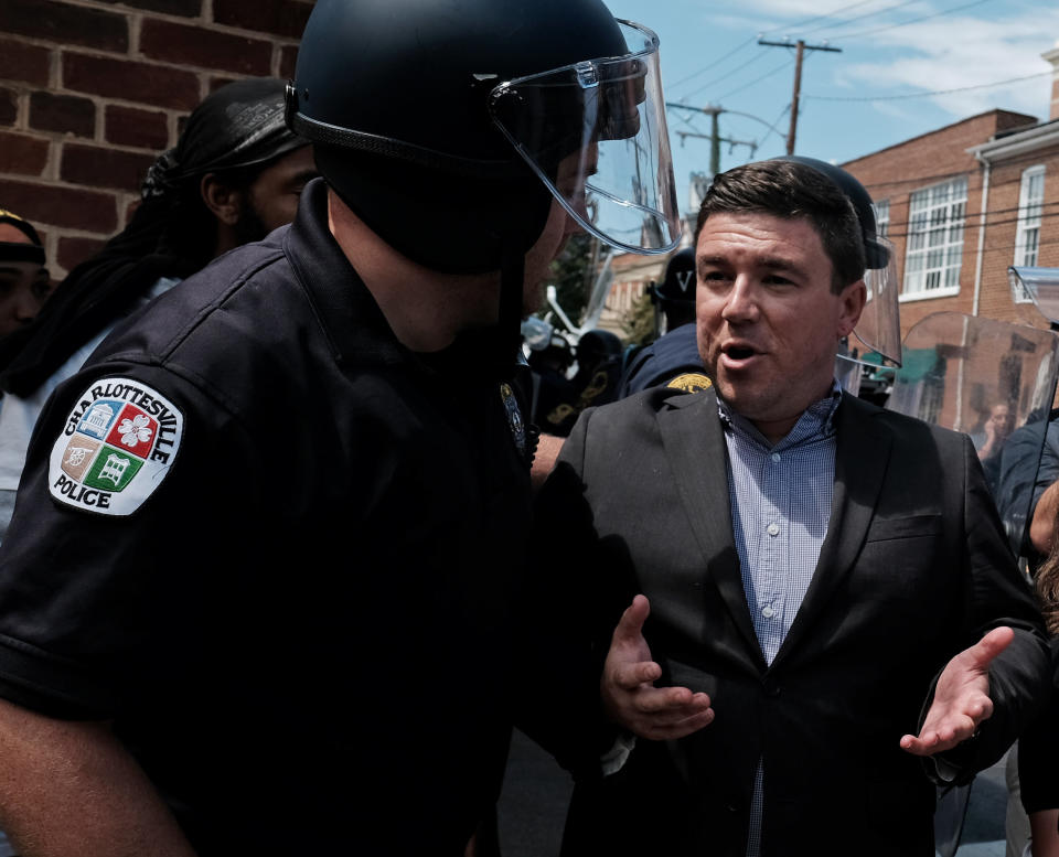 Unite The Right rally organizer Jason Kessler is escorted by police after he attempted to speak at a press conference in front of Charlottesville City Hall in Charlottesville, Virginia, August 13, 2017.&nbsp; (Photo: Justin Ide / Reuters)