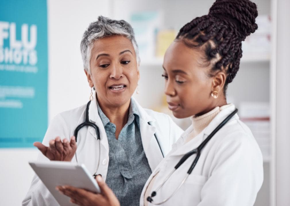 Two medical professionals in white coats.