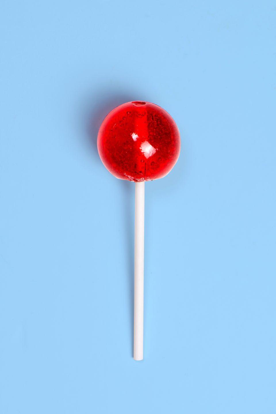 <p><strong><em>How is the "mystery flavor" of Dum Dums lollipops made?</em></strong></p><p><strong>Answer: </strong>Rather than clean the machines out between flavor batches, the company will take the leftovers of flavor A and the leftovers of flavor B and combine them to make the mystery flavor. They then use a wrapper with question marks design to signify its mysterious flavor profile.</p>