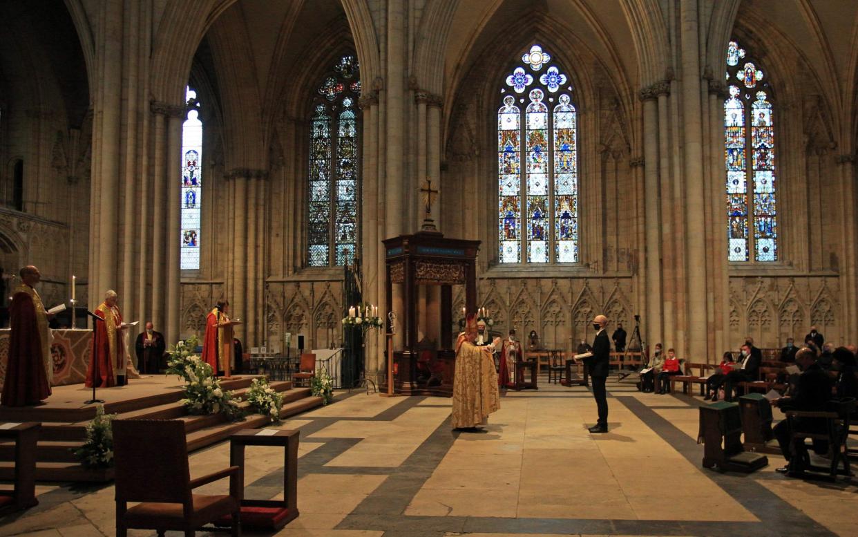 The Most Reverend Stephen Cottrell (C), the 98th Archbishop of York, is enthroned at a ceremony during a service of evensong - LINDSEY PARNABY /AFP