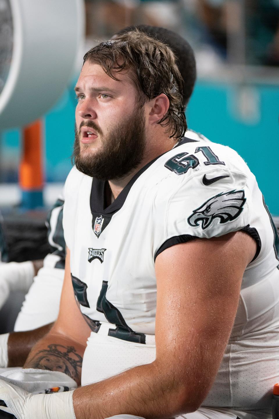 Philadelphia Eagles guard Josh Sills (61) sits on the sidelines during an NFL football game against the Miami Dolphins, Saturday, Aug. 27, 2022, in Miami Gardens, Fla.