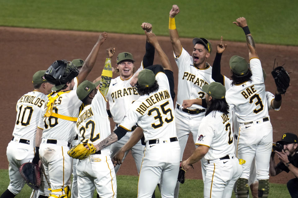 The Pittsburgh Pirates celebrate after getting the final out of a win over the Arizona Diamondbacks in a baseball game in Pittsburgh, Friday, May 19, 2023. (AP Photo/Gene J. Puskar)