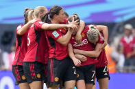 Manchester United's Ella Toone, 2nd right, celebrates with her teammates after scoring the opening goal during the Women's FA Cup final soccer match between Manchester United and Tottenham Hotspur at Wembley Stadium in London, Sunday, May 12, 2024. (AP Photo/Kirsty Wigglesworth)