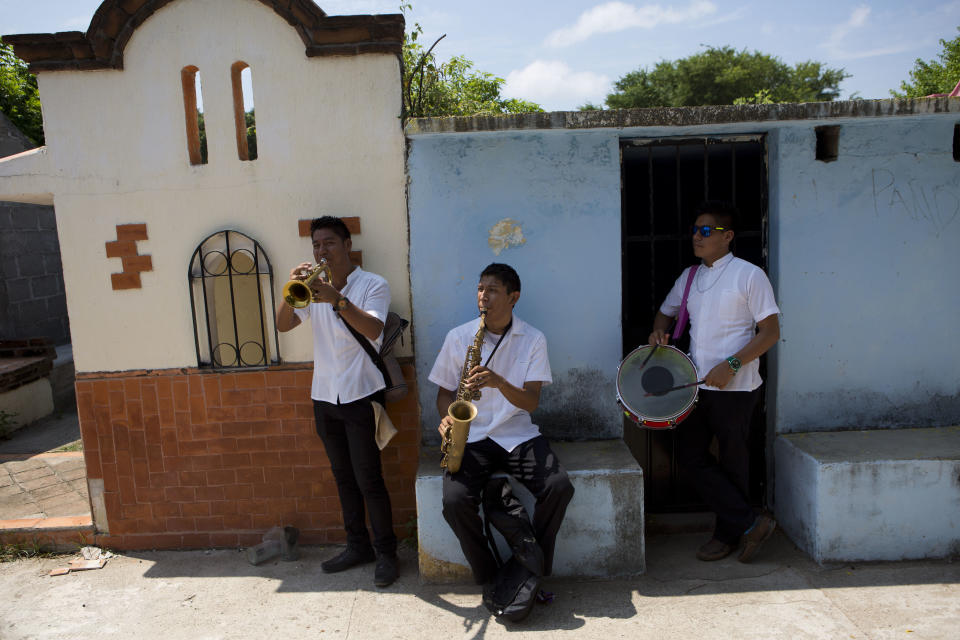 <p>Musicians stand in front of tombs as they play during the burial of 64-year-old Reynalda Matus inside Miercoles Santo Cemetery, in Juchitan, Oaxaca state, Mexico, Saturday, Sept. 9, 2017. Matus was killed when the pharmacy where she worked nights collapsed during Thursday’s massive earthquake. (AP Photo/Rebecca Blackwell) </p>