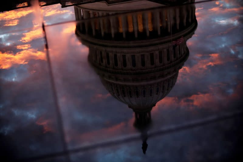 FILE PHOTO: The U.S. Capitol dome is reflected in the glass skylight of the Capitol Visitor Center in Washington