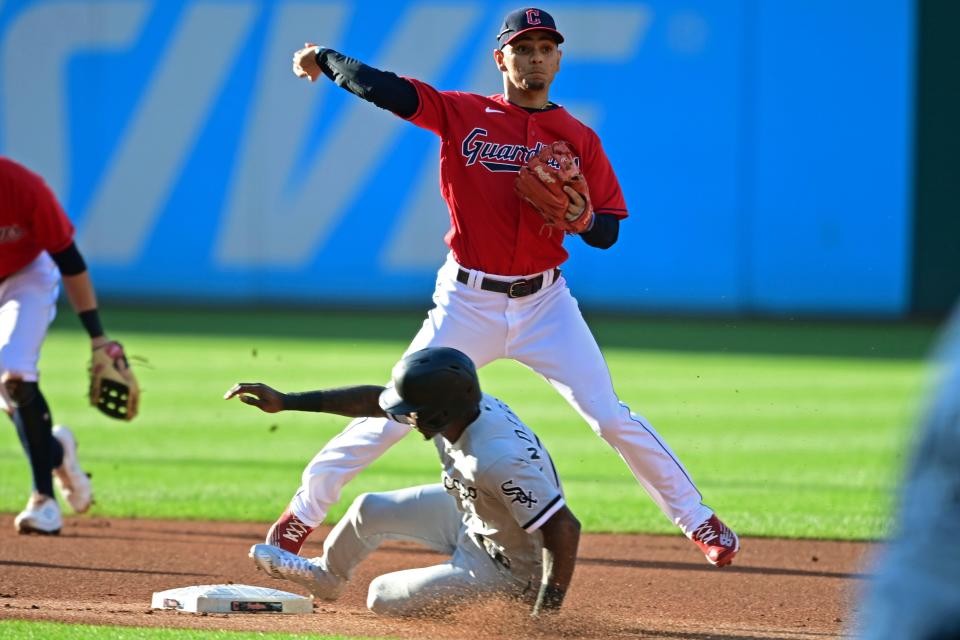 Guardians shortstop Andres Gimenez throws to first after forcing out Chicago White Sox's Tim Anderson at second base in the first inning of the second game of a doubleheader Tuesday. The White Sox won the second game 7-0 to earn a split. [David Dermer/Associated Press]