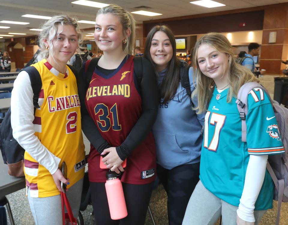 Walsh Jesuit High School junior Emyrson Flora (second from left) was back on campus with friends Madeline Grebenc (left), Alyson Carr (right) and Chloe Ruth on Thursday in Cuyahoga Falls.