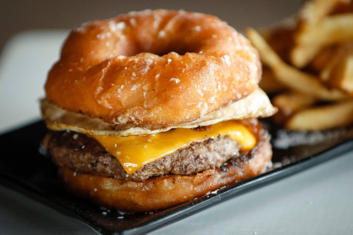 The Spalding Burger made with a six-ounce season beef patty, aged cheddar cheese, smoked bacon, a fried egg and served Spalding glazed donut on a at Bad Wolf Burgers in Lexington, Ky.,Tuesday, Sept. 15, 2020.