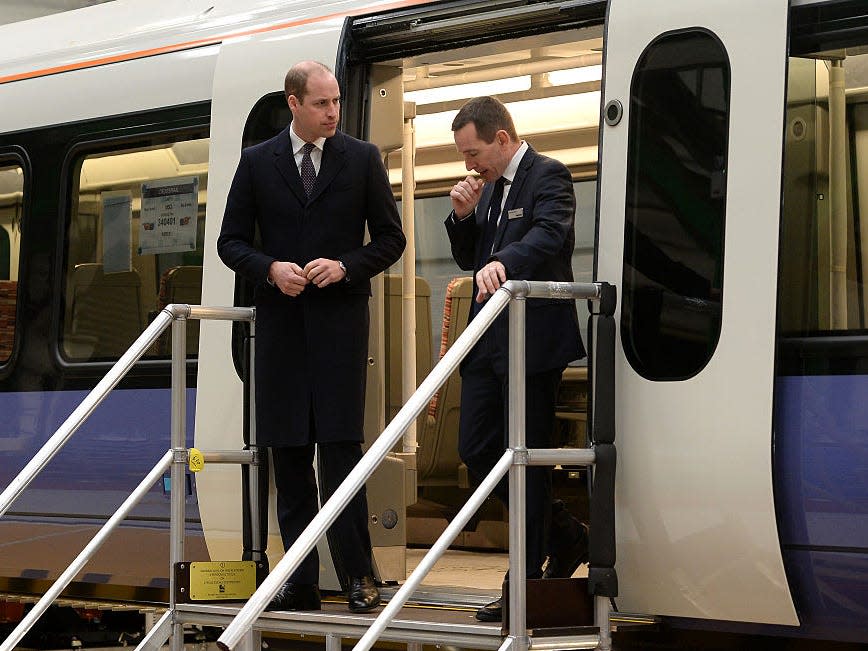 Prince William tours a train in 2016.