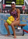 U.S. Swimmer Janet Evans of Placentia, Calif., takes a break poolside, July 24, 1992, in Barcelona before the 1992 Olympic Games. (AP Photo/Russell Mcphedran)