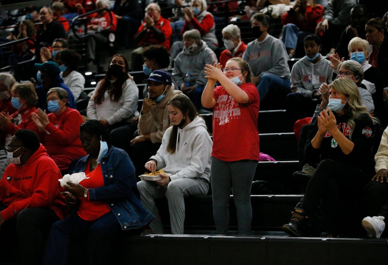 Emmy Sheldon cheers for her sister Jacy during a game in 2021.