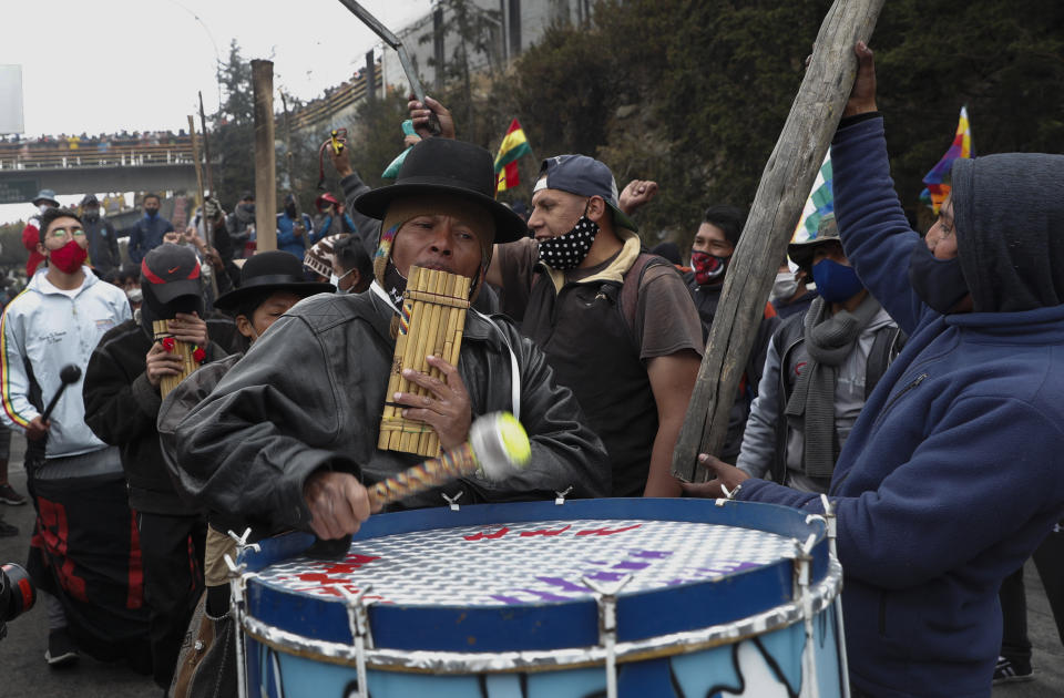 Musicians play during a protest against the postponement of the presidential election, in El Alto, Bolivia, Tuesday, Aug. 11, 2020. Citing the ongoing new coronavirus pandemic, Bolivia's highest electoral authority delayed presidential elections from Sept. 6 to Oct. 18, the third time the vote has been delayed. (AP Photo/Juan Karita)