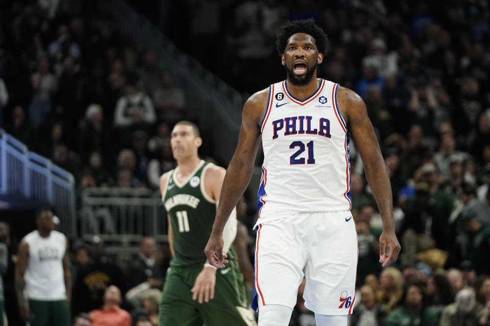 Philadelphia 76ers' Joel Embiid (21) reacts after making a basket during the second half of an NBA basketball game against the Milwaukee Bucks, Saturday, March 4, 2023, in Milwaukee. (AP Photo/Aaron Gash)