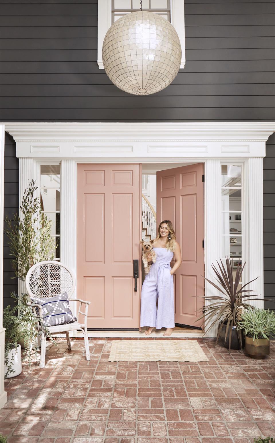 Hilary Duff says she has “never seen myself as girlie,” but the front door of the <a href="http://people.com/home/hilary-duff-california-house-tour/" rel="nofollow noopener" target="_blank" data-ylk="slk:California home she shares with son Luca;elm:context_link;itc:0;sec:content-canvas" class="link ">California home she shares with son Luca</a> begs to differ. <strong>Buy it!</strong> BEHR Premium Plus paint in Castilian Pink, $28 per gallon; <a href="http://www.anrdoezrs.net/links/8029122/type/dlg/sid/POHOMEShoptheLookHomesMS/https://www.homedepot.com/p/BEHR-Premium-Plus-1-gal-S170-3-Castilian-Pink-Semi-Gloss-Enamel-Interior-Paint-305001/205289462" rel="nofollow noopener" target="_blank" data-ylk="slk:homedepot.com;elm:context_link;itc:0;sec:content-canvas" class="link ">homedepot.com</a>