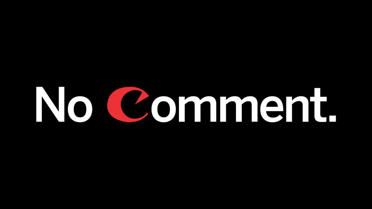  The text "no comment" with a letter "C" styled after the Canon logo. 