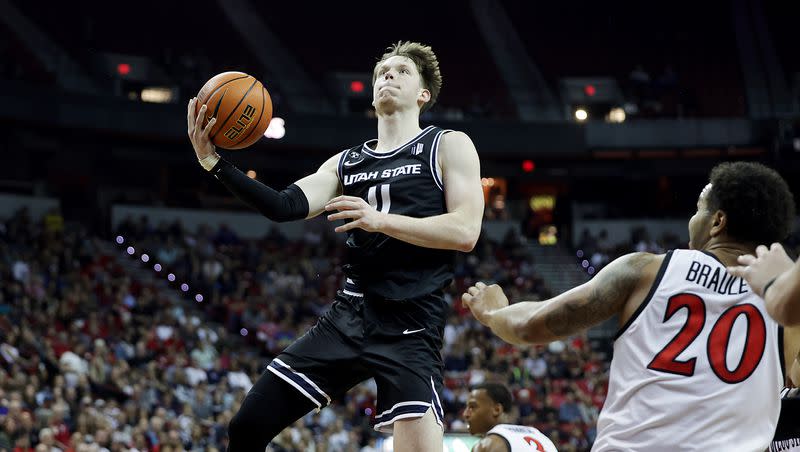 Utah State Aggies guard Max Shulga (11) is entering the NCAA transfer portal, as is with teammate Sean Bairstow.