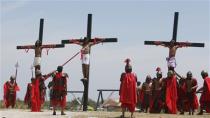 Penitents hang on wooden crosses during the re-enactment of the crucifixion of Jesus Christ on Good Friday in San Fernando, Pampanga in northern Philippines April 18, 2014. REUTERS/Erik De Castro