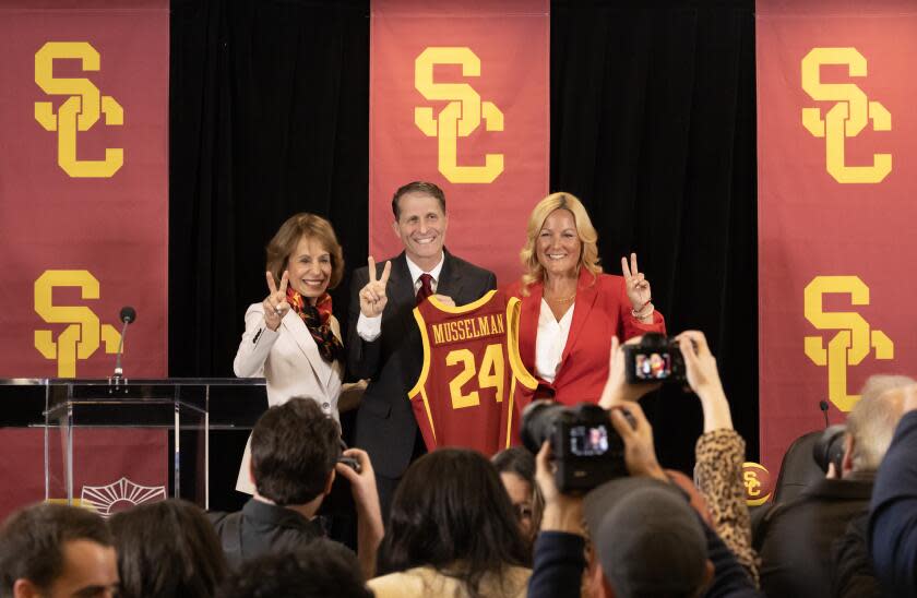 LOS ANGELES, CA-APRIL 05: USC President Carol Folt, left, Eric Musselman and athletic director.