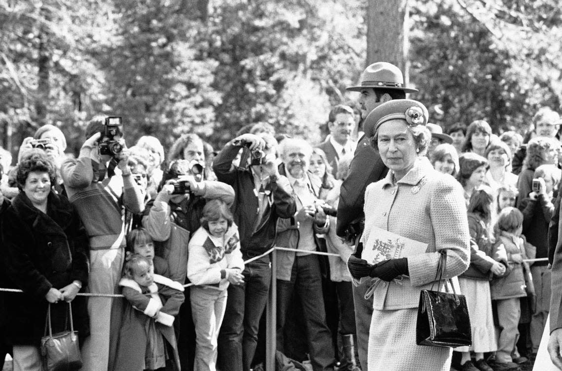 Pleased visitors to Yosemite National Park get a glimpse of Queen Elizabeth II on Sunday, March 7, 1983 as she left the Community Church chapel following services. Walt Zeboski/ASSOCIATED PRESS