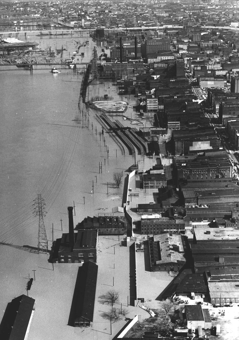 The Louisville waterfront was invaded by the Ohio River around 10th and 11th streets when floodwall gates and sandbags leaked, March 11, 1964.