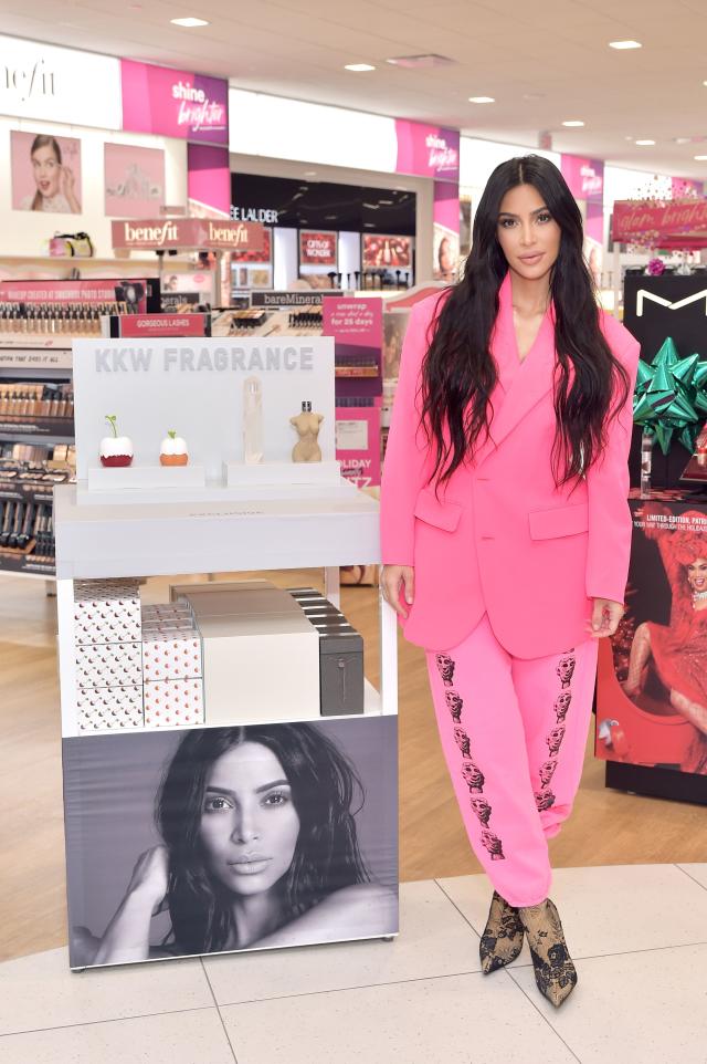 Kim Kardashian Wears Gray Bodycon Dress & Matching Sock Boots