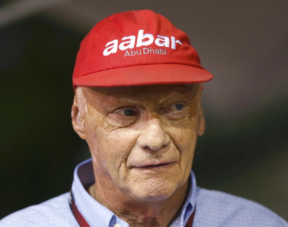 Former Formula One racing driver and three-time F1 World Champion Niki Lauda of Austria looks on in the Red Bull garage during the Singapore F1 Grand Prix at the Marina Bay street circuit in Singapore September 21, 2013. REUTERS/Pablo Sanchez (SINGAPORE - Tags: SPORT MOTORSPORT SPORT MOTORSPORT F1 HEADSHOT)