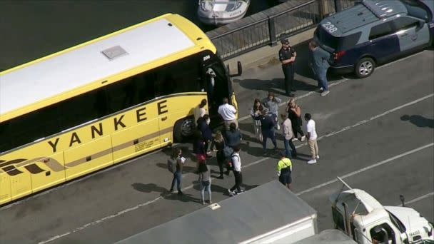 PHOTO: Migrants board a bus back to the mainland from Martha's Vineyard, Sept. 16, 2022.  (WCVB)