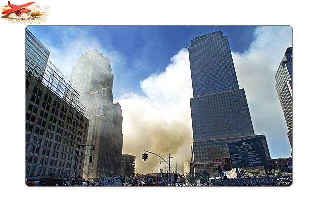 Smoke billows from the scene of the World Trade Center in New York. Both towers of the World Trade Center collapsed on 11 September 2001 after hijacked passenger airliners were flown into them. Over 2000 people lost their lives in this terror attack.