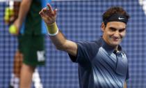 Switzerland's Roger Federer waves after winning his quarter final match against Grigor Dimitrov of Bulgaria at the Swiss Indoors ATP tennis tournament in Basel October 25, 2013. REUTERS/Arnd Wiegmann