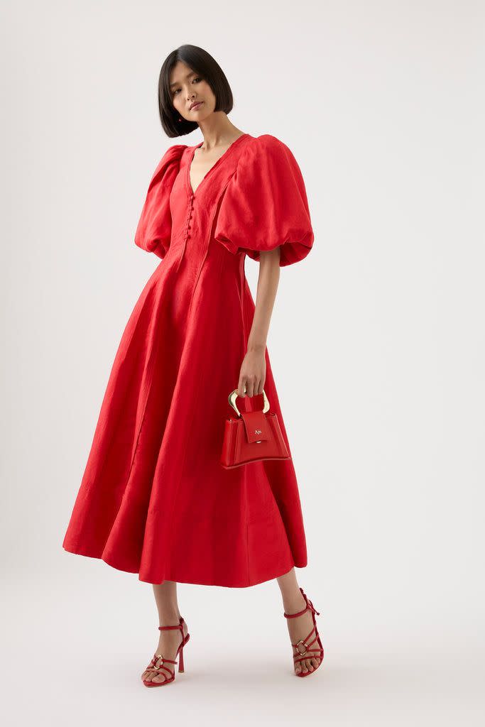 <p><a href="https://go.redirectingat.com?id=74968X1596630&url=https%3A%2F%2Fajeworld.com%2Fproducts%2Fdusk-puff-sleeve-midi-dress-scarlet-red&sref=https%3A%2F%2F" rel="nofollow noopener" target="_blank" data-ylk="slk:Shop Now;elm:context_link;itc:0;sec:content-canvas" class="link rapid-noclick-resp">Shop Now</a></p><p>Dusk Puff Sleeve Midi Dress</p><p>ajeworld.com</p><p>$345.00</p>