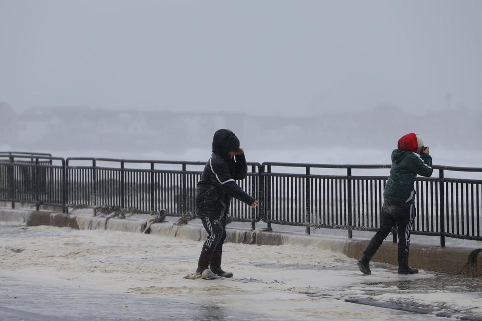 A winter storm rips through Hampton Beach leaving streets flooded and damage from high winds on Jan. 17, 2022.