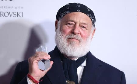 Bruce Weber, winner of the Isabella Blow Award for Fashion Creator poses for photographers at the Fashion Awards 2016 in London, Britain December 5, 2016. REUTERS/Neil Hall/Files