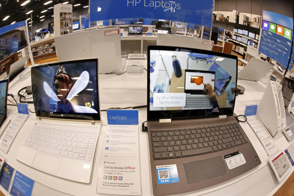 This Thursday, Feb. 22, 2018 photo shows a display of Hewlett Packard laptop computers in a Best Buy store in Pittsburgh. (AP Photo/Gene J. Puskar)