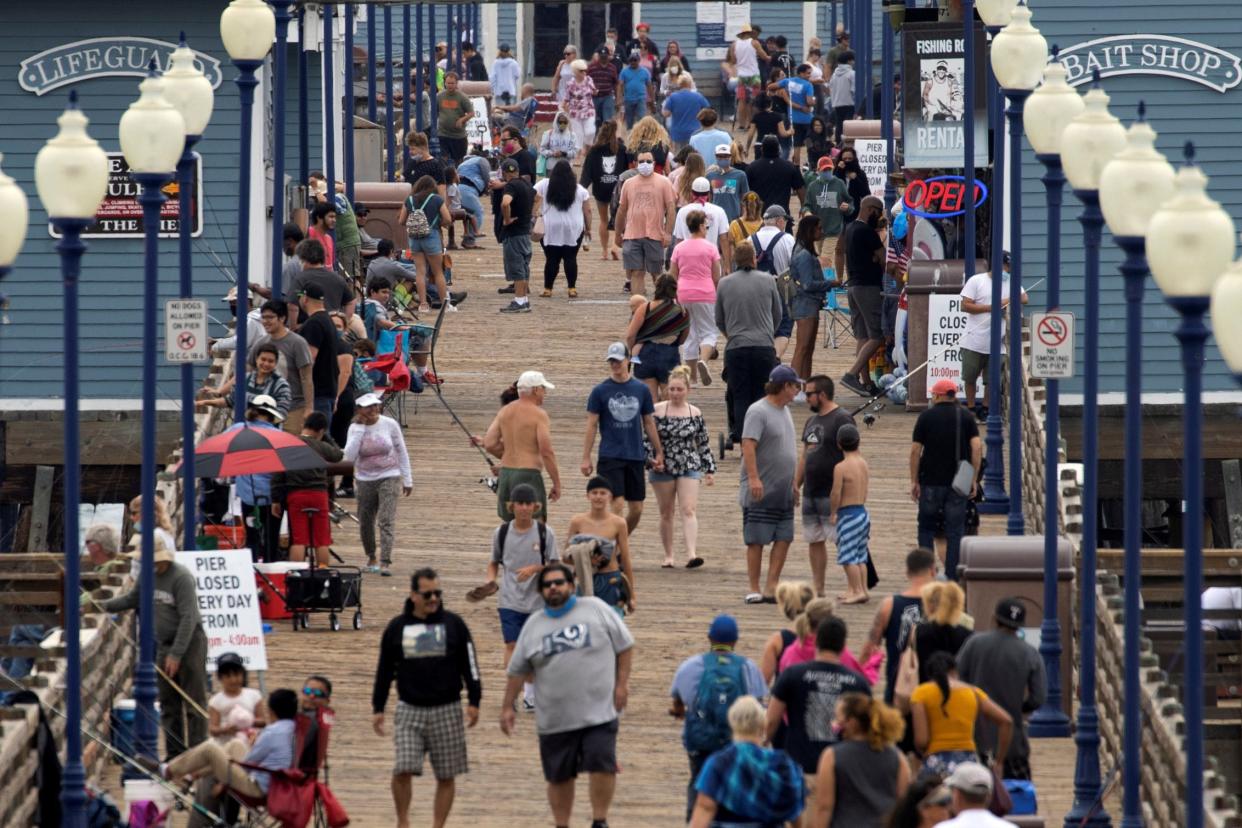 california beach pier coronavirus oceanside crowd masks