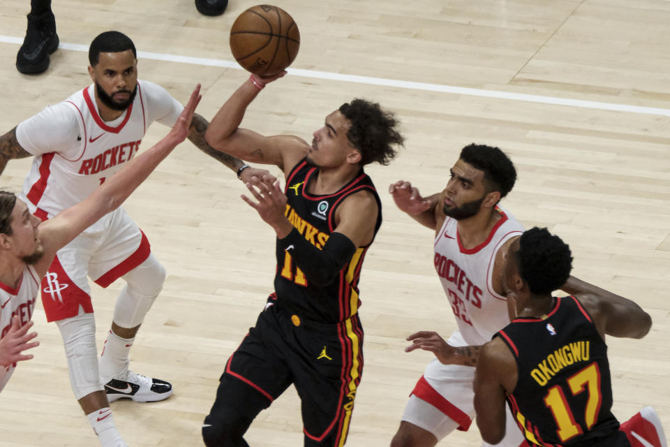 Atlanta Hawks guard Trae Young (11) shoots against the Houston Rockets during the first half of an NBA basketball game on Sunday, May 16, 2021, in Atlanta. (AP Photo/Ben Gray)