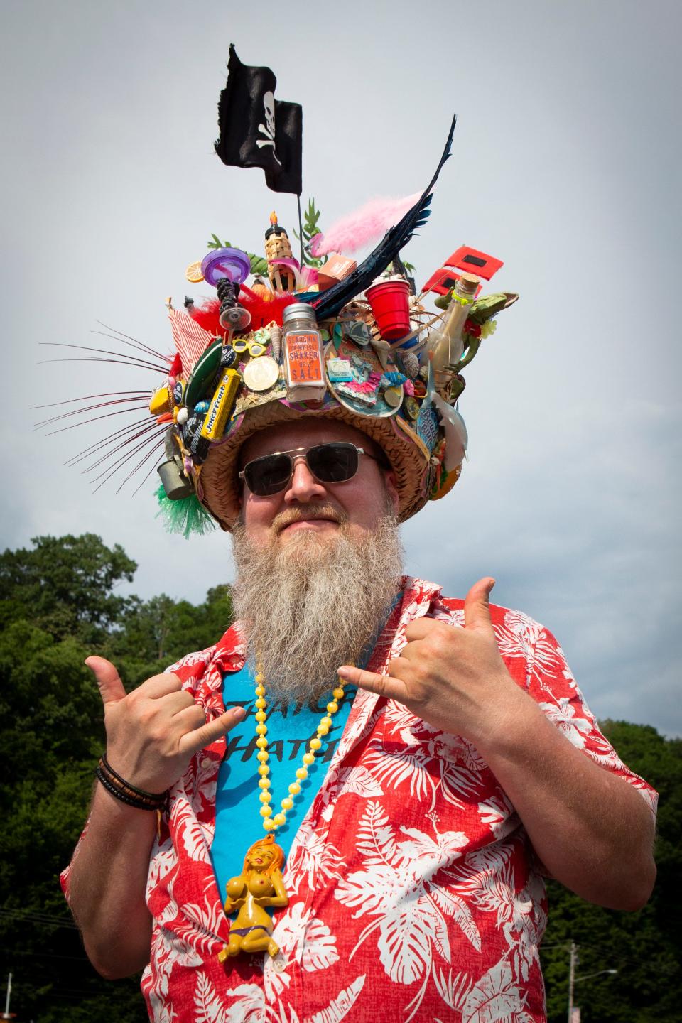 Jimmy, of Lexington, Kentucky, wears a hat he made to the Jimmy Buffett & The Coral Reefer Band concert at Riverbend Music Center on Thursday, July 18, 2019. He made the hat in 1994 and adds something new to it every year.